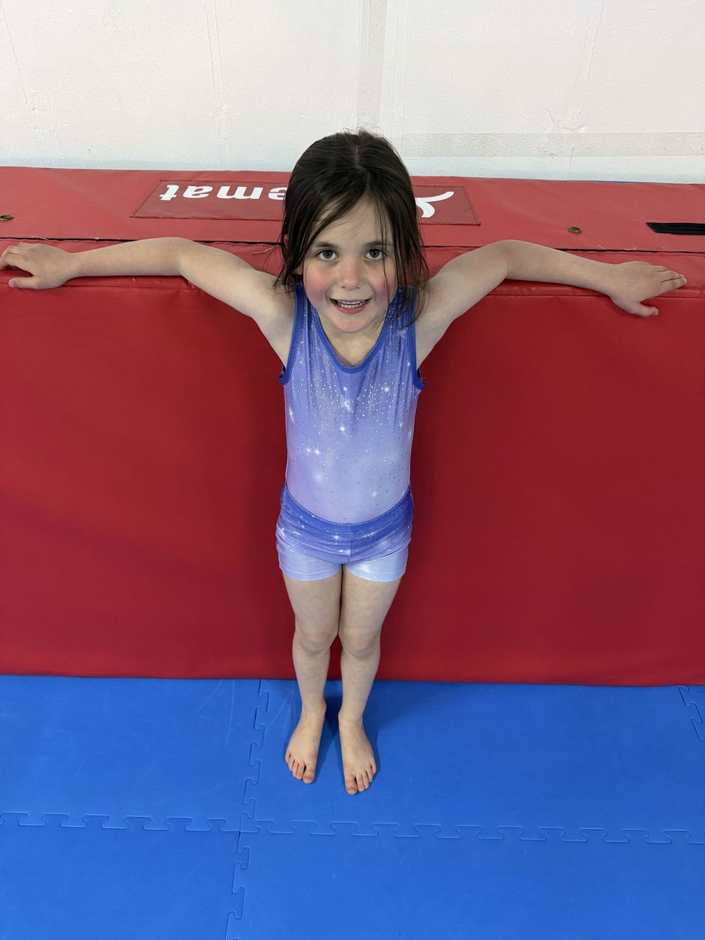 A gymnast holding a balance