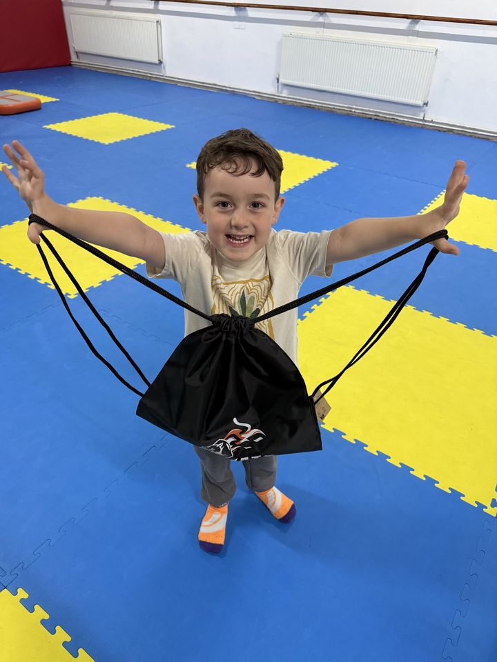 A young gymnast in the gym with a Wildkatz bag