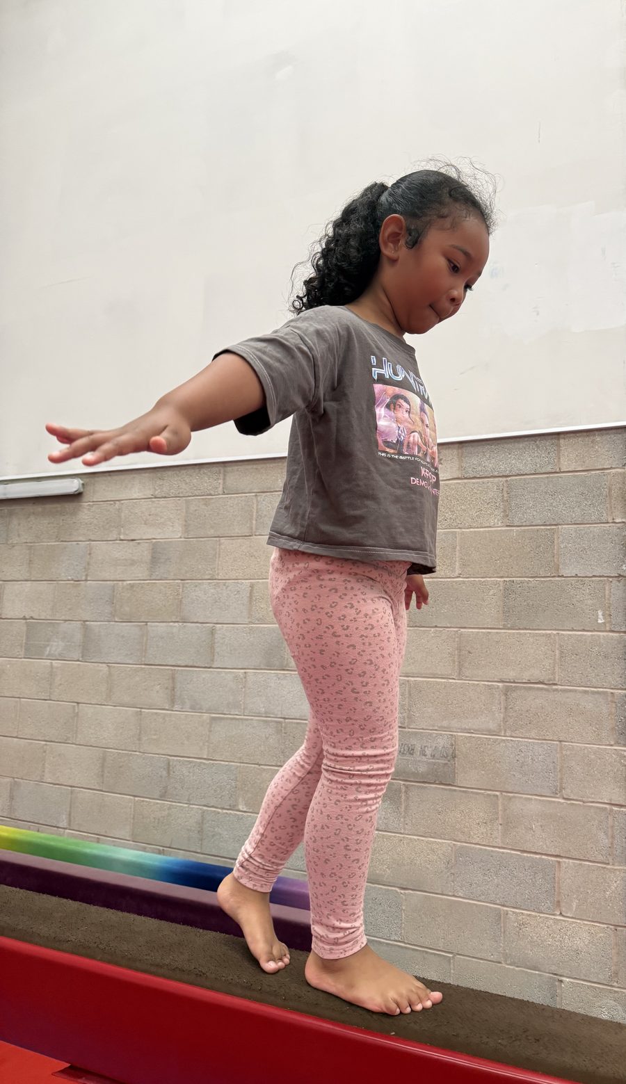 A gymnast balancing on the beam